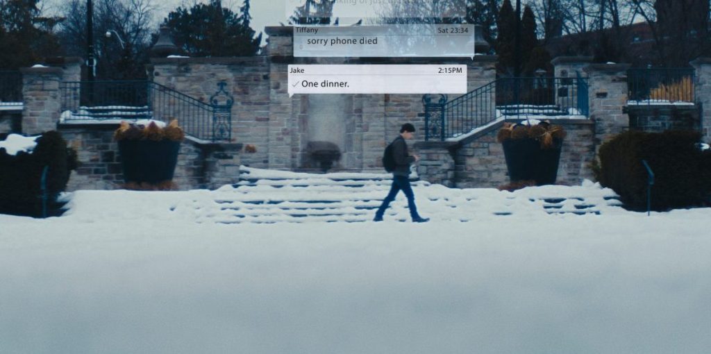 Straw Man Movie - 2025 still man walking in snow and texting